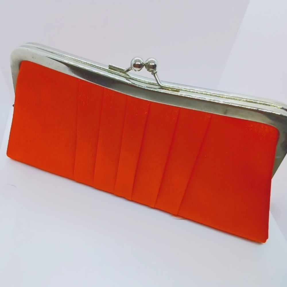 Tangerine colored satin clutch purse